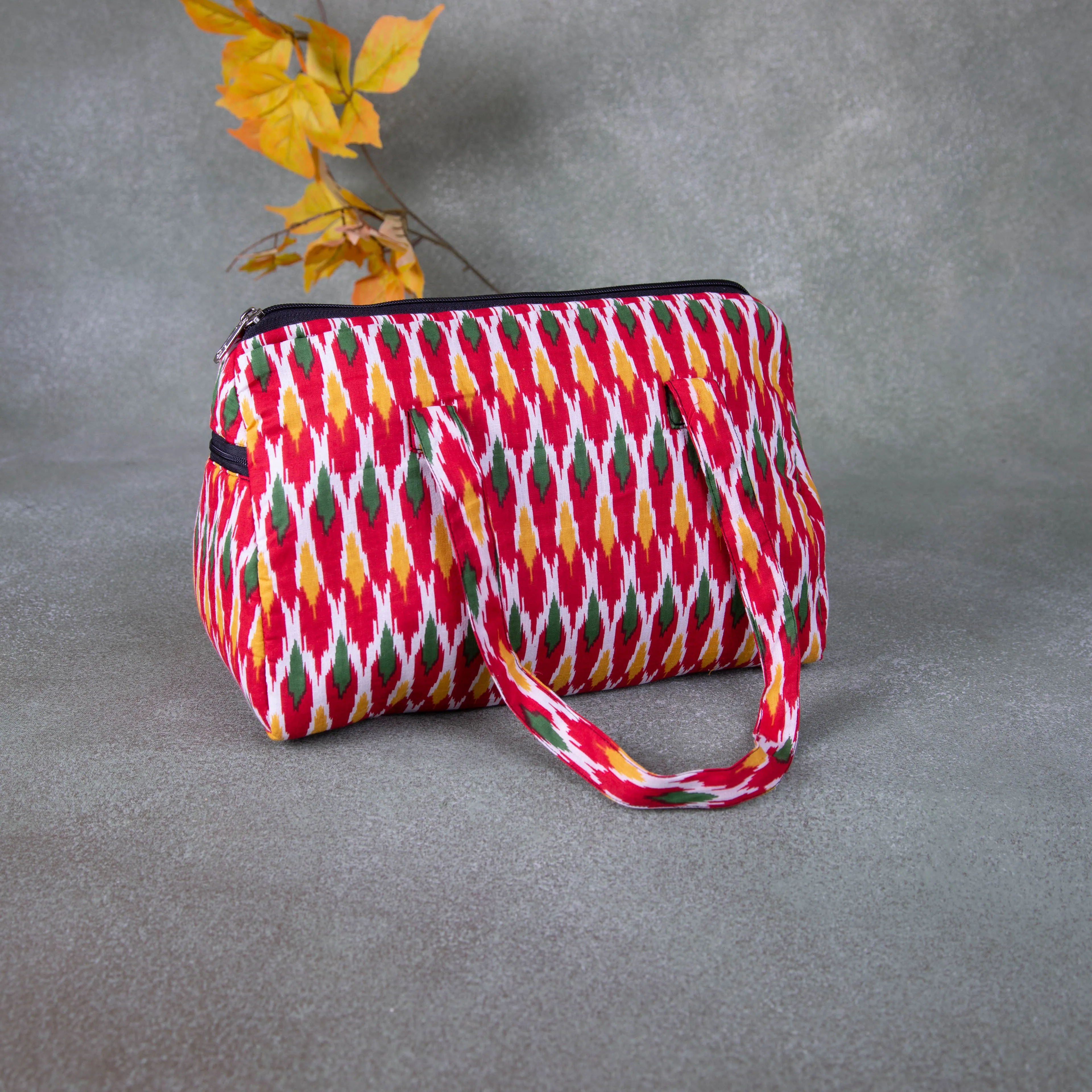 Barrel Handbags Red with Green Ikat Prints.