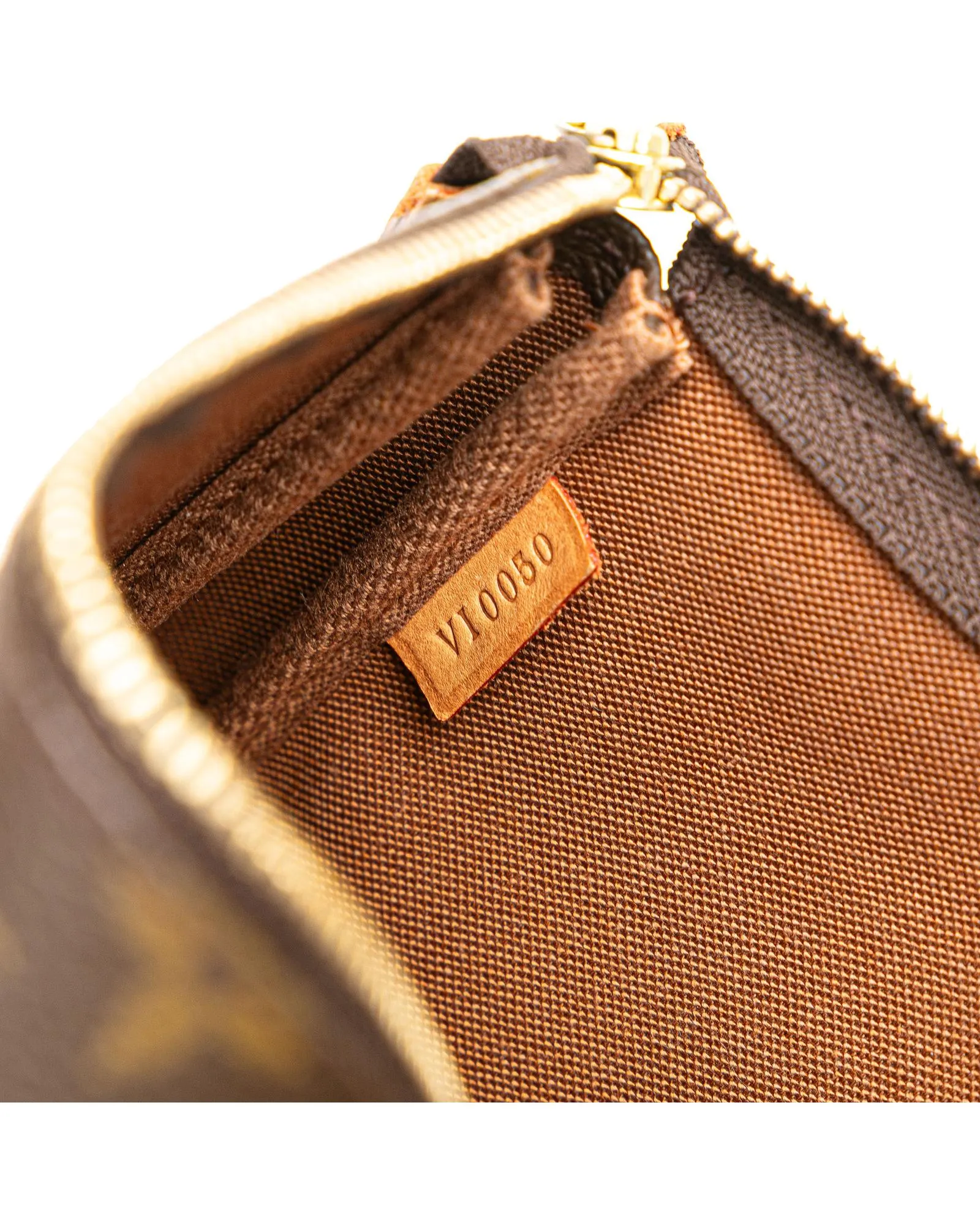 Monogram Pochette with Vachetta Leather Strap and Top Zip Closure